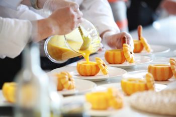 two chefs making a dessert for halloween