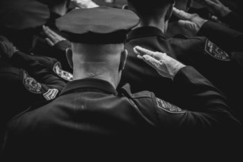 a group of police officers saluting their captain