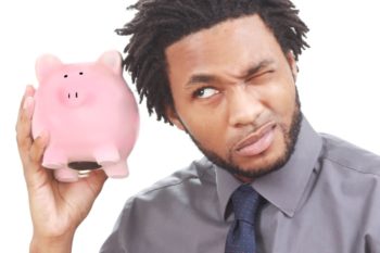 a man holding his piggy bank