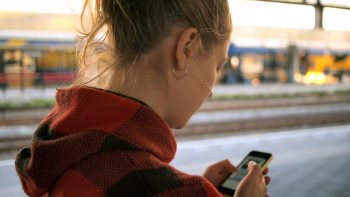 a college student checking her phone