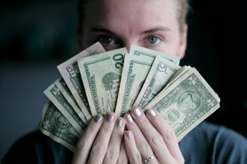 student holding money